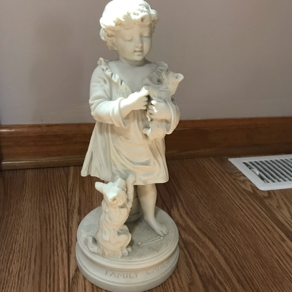 Family Cares Boy with Dogs Statue